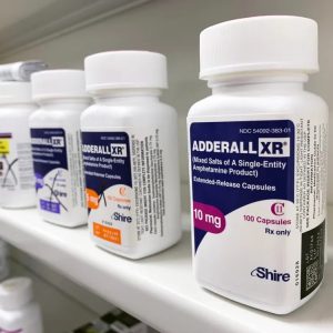 Sealed containers of Adderall medication, each labeled with the Adderall name and different dosage strengths in milligrams (MG). Adderall For Sale Canada